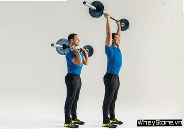Người tập thực hiện động tác overhead presses với tạ đòn