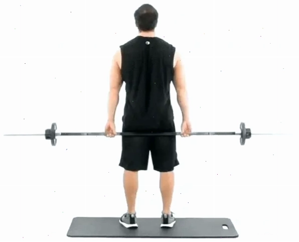 Phía sau của một người đàn ông đang thực hiện bài tập barbell shrugs